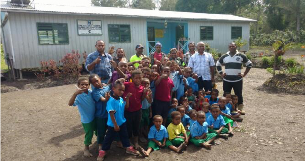 Coffee farmers and their families at the Butterfly School on the Bunum-Wo coffee estate in Papua New Guinea, a school co-founded and supported by Peet's Coffee.